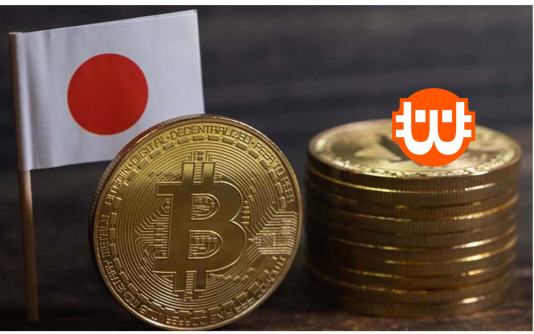 japán zászló előtte bitcoinérmék egyik az élén, mellette lapukra fektetve egymáson